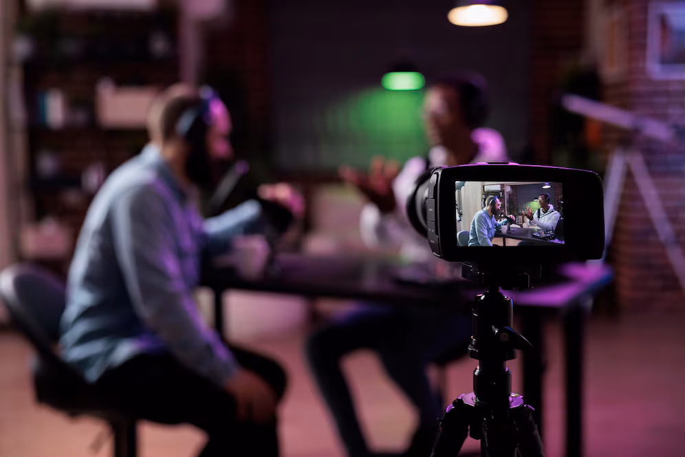 Ontraccoach in the media multiethnic team people meeting broadcast internet podcast recording video discussion camera influencer guest talking online livestream create social media channel content 482257 45