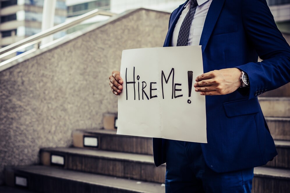 Career Transition - Image Career Transition unemployed man desperately looking job holding need job sign 1150 3021